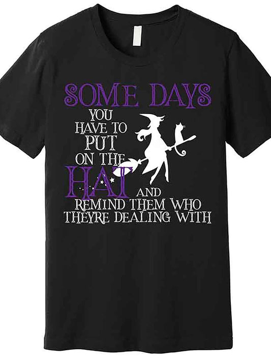 "Funny Witch Halloween Graphic T-Shirt for Men - 'Put On The Hat' Premium Short Sleeve Cotton Blend Tee with Playful Witch Design, Black, Casual Round Neck, Machine Washable", Halloween Apparel | Text Graphic Shirt | Glossy Finish